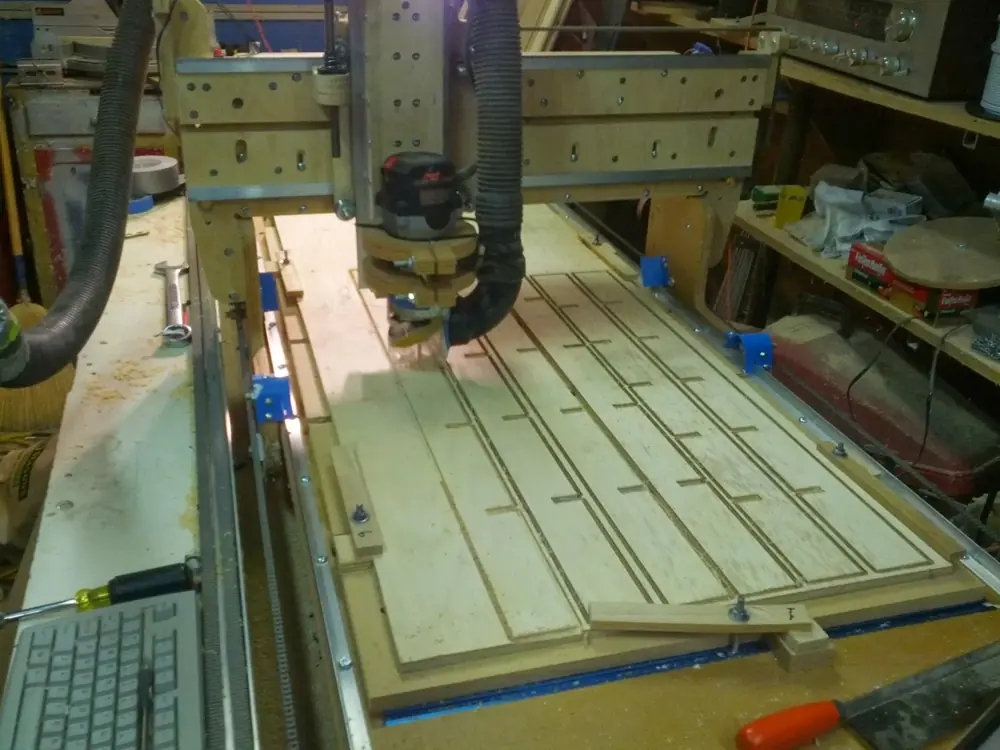 CNC router cutting long slots in a panel